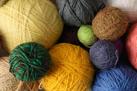 Balls of yarn all over background, closeup.