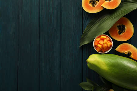 Fresh ripe papaya on wooden background, space for textの写真素材