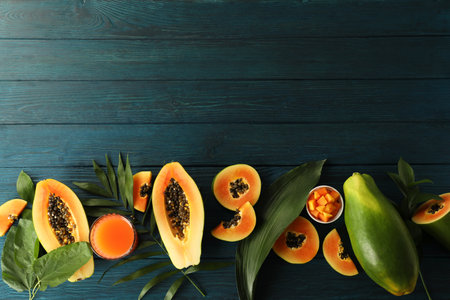 Fresh ripe papaya on wooden background, space for textの写真素材