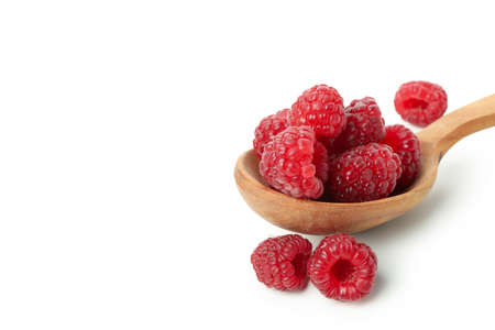 Wooden spoon with raspberries, isolated on white background.