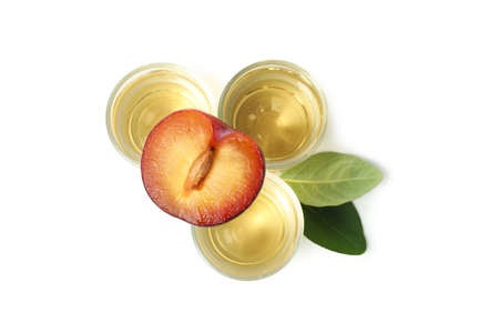 Plum vodka shots isolated on white backgroundの写真素材