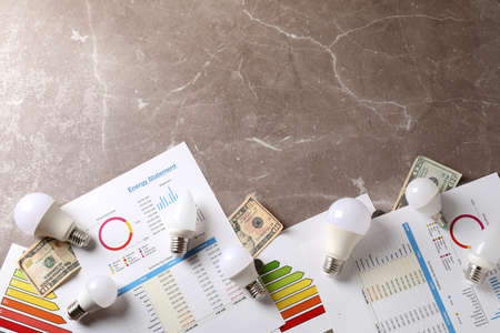 Energy saving concept on gray textured background.の写真素材