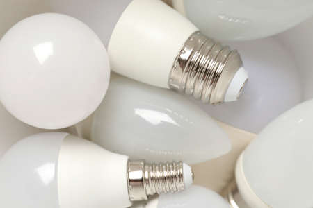Energy saving light bulbs all over background.の写真素材