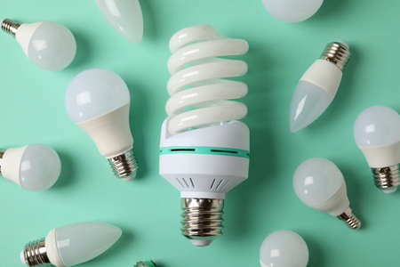 Energy saving bulbs on mint background, top view.の写真素材