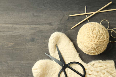 Concept of knitting with yarn ball on gray wooden tableの写真素材