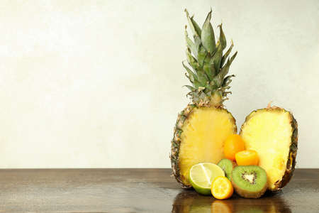Exotic fruits on wooden table against white background.の写真素材