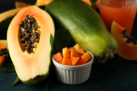 Fresh papaya and juice on wooden table, close upの写真素材