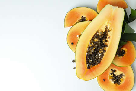 Fresh ripe papaya with leaves on white backgroundの写真素材