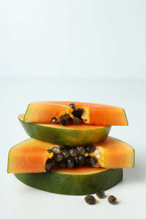 Fresh ripe papaya slices on white backgroundの写真素材