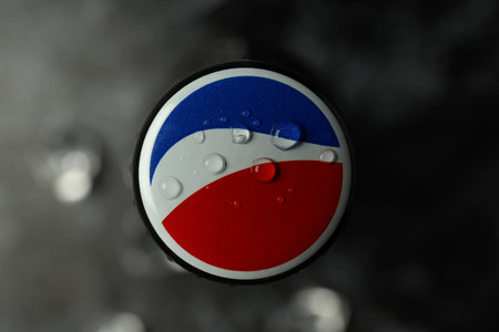 Odessa, Ukraine - September 23, 2021: Pepsi bottle on dark background, top view and closeup.