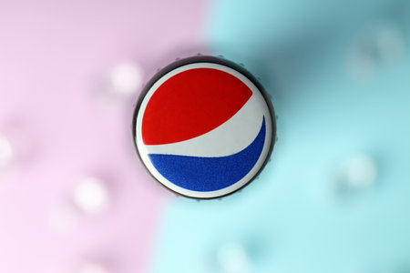 Odessa, Ukraine - September 23, 2021: Pepsi bottle on two tone background, top view and macro.