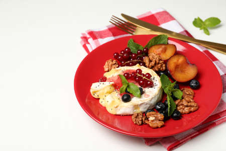 Concept of tasty food with grilled camembert on white background.の写真素材