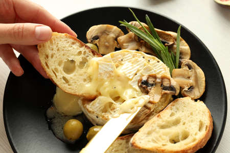 Concept of tasty food with grilled camembert, close up.の写真素材