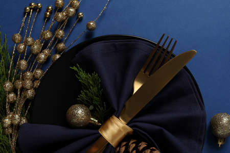 New Year table setting on blue background.の写真素材