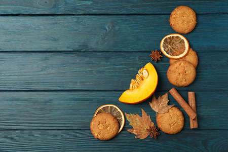 Pumpkin cookies on blue wooden background, space for text.の写真素材