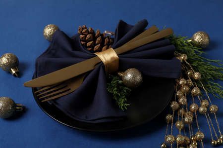 New Year table setting on blue background.の写真素材