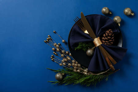 New Year table setting on blue background.の写真素材