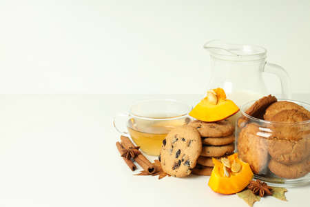 Concept of tasty food with pumpkin cookies on white table.の写真素材
