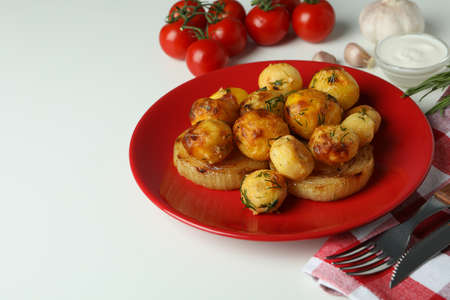 Concept of tasty food with baked potato on white background.の写真素材