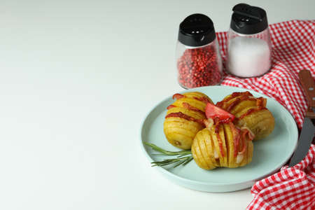 Concept of tasty food with baked potato on white background.の写真素材