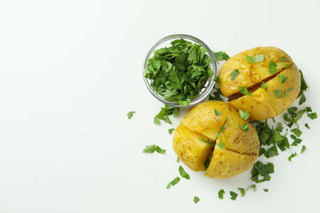 Baked potato with parsley on white background.の写真素材