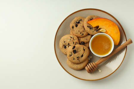 Concept of tasty food with pumpkin cookies on white background.の写真素材
