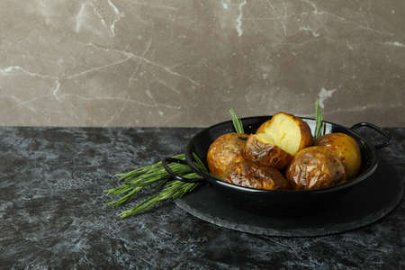 Concept of tasty food with baked potato on black smokey table.の写真素材