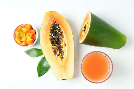 Fresh ripe papaya and juice on white backgroundの写真素材