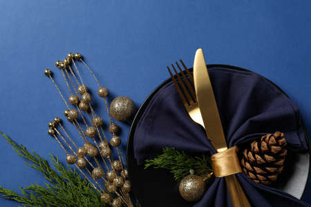 New Year table setting on blue background.の写真素材