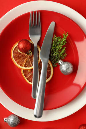 New Year table setting on red background.の写真素材