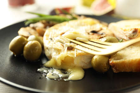 Concept of tasty food with grilled camembert, close up.の写真素材