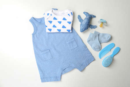 Concept of cute baby clothes on white background.の写真素材