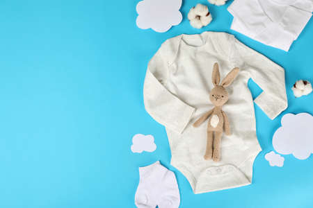 Concept of cute baby clothes on blue background.の写真素材