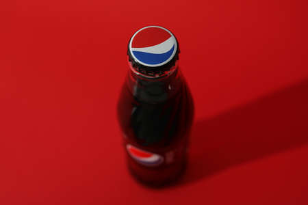 Odessa, Ukraine - September 23, 2021: Pepsi bottle on red background.のeditorial素材