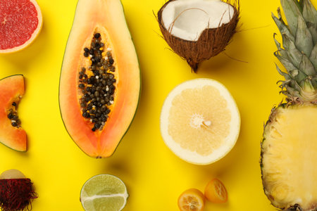 Exotic fruits set on yellow background, top view.の写真素材