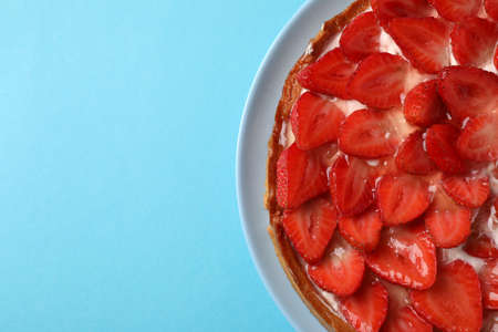 Strawberry tart on blue background, space for text.の写真素材