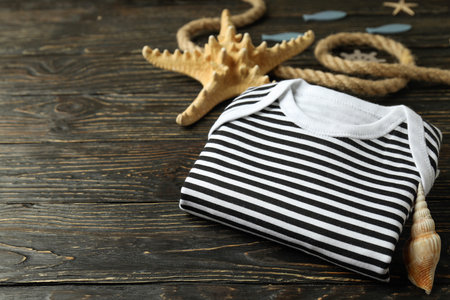 Marine concept of baby clothes on wooden background.の写真素材