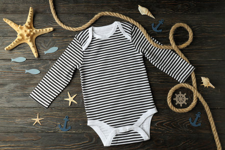 Marine concept of baby clothes on wooden background.の写真素材