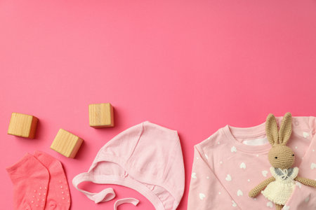 Concept of female baby clothes on pink background.の写真素材