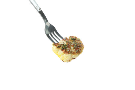 Fork with baked cauliflower isolated on white background.の写真素材