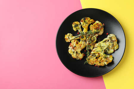 Plate with baked cauliflower on two tone background.の写真素材