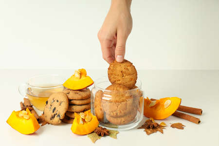 Concept of tasty food with pumpkin cookies on white table.の写真素材
