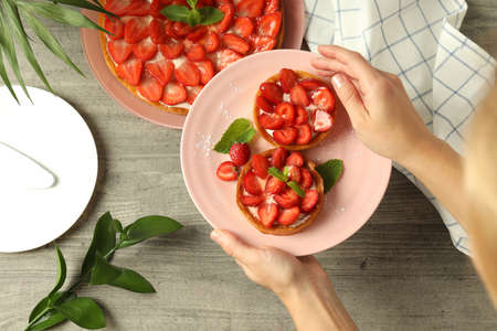 Concept of tasty eating with strawberry tarts, top view.の写真素材