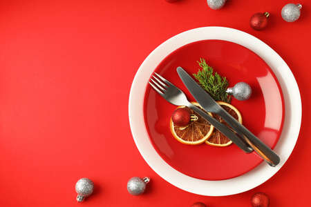 New Year table setting on red background.の写真素材