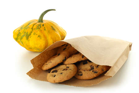 Paper bag with cookies and pumpkin isolated on white background.の写真素材