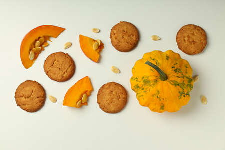 Concept of tasty food with pumpkin cookies on white background.の写真素材