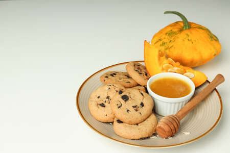 Concept of tasty food with pumpkin cookies on white background.の写真素材