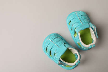 Mint baby sandals on light gray background.の写真素材