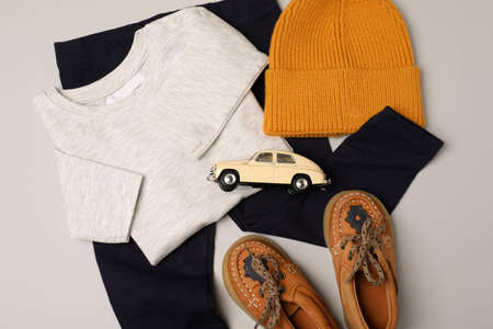 Concept of male baby clothes on light gray background.の写真素材