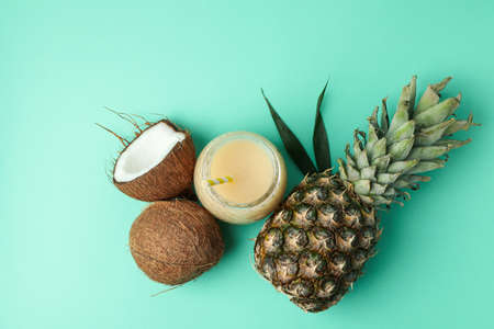 Pina colada cocktail and ingredients on mint background.の写真素材